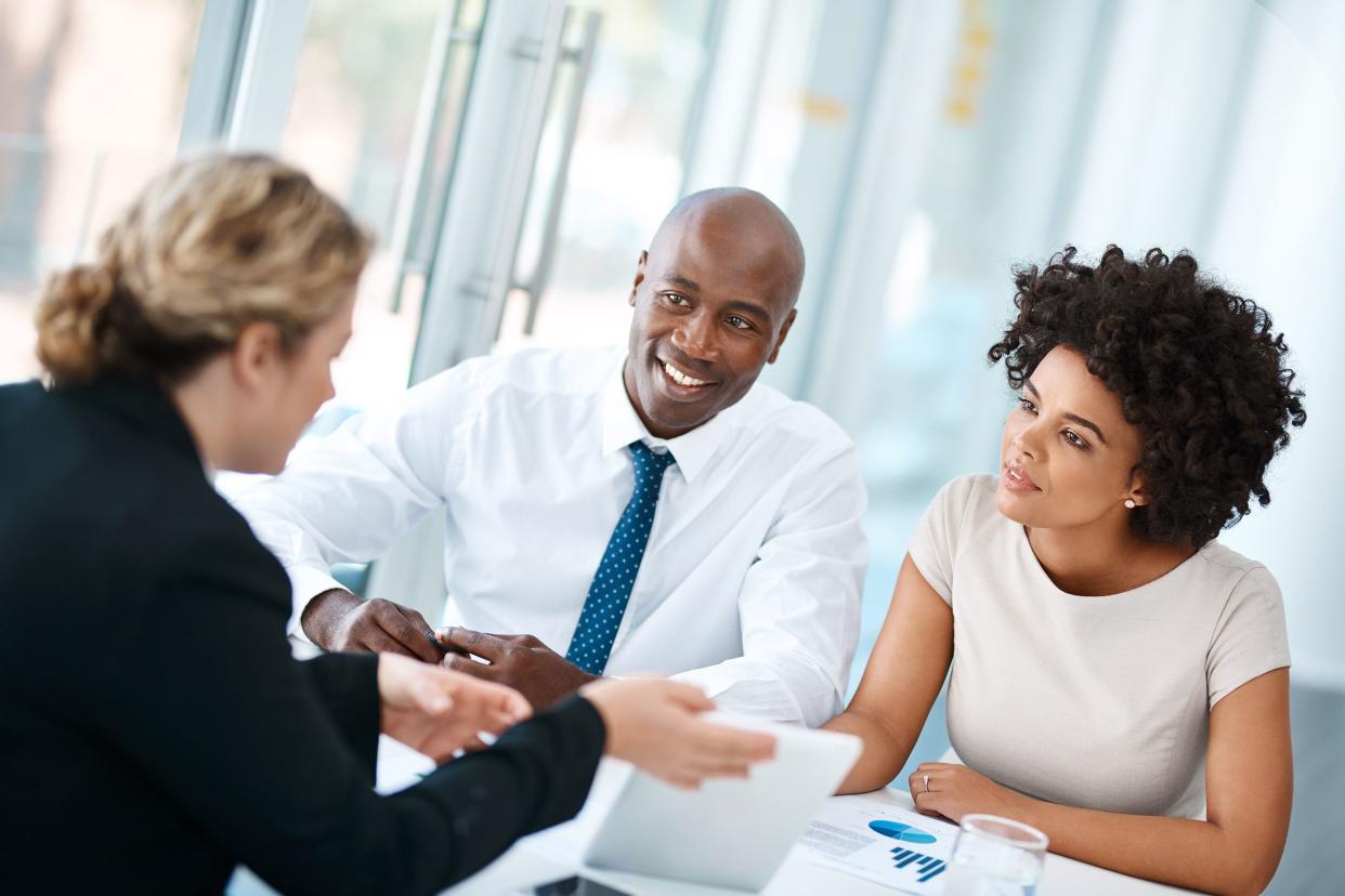 couple consulting with life insurance seller