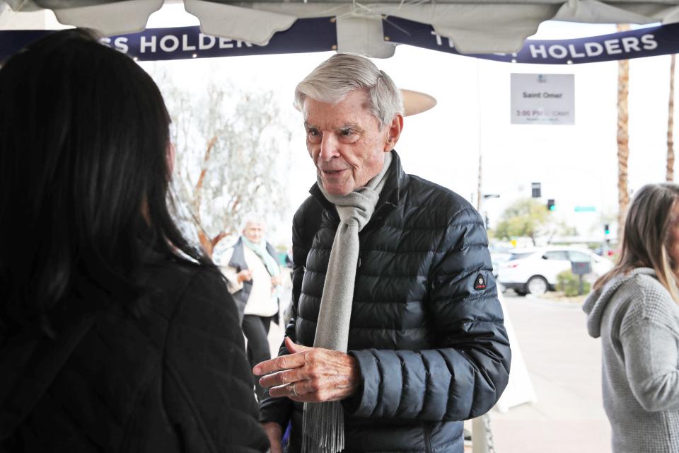 Charles Nisbet, a retired economics professor talks to fellow Palm Springs International Film Festival pass holder, Annette Weis, before seeing "Saint Omer" in Palm Springs, Calif., on Monday, Jan. 9, 2023.