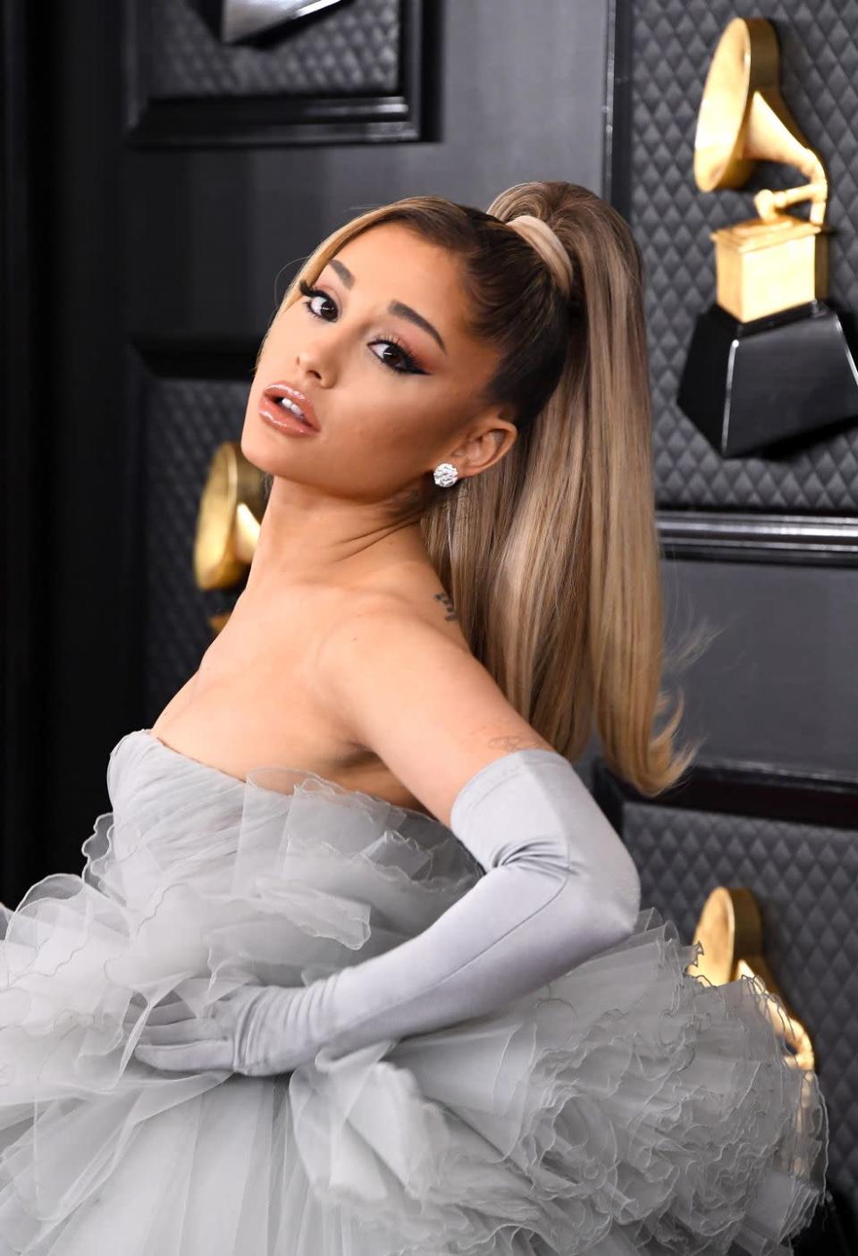 <p>Channel retro vibes inspired by the queen of ponytails herself, <strong>Ariana Grande</strong>. Flip out the ends and keep the bangs out on one side for a glam take on a '90s style. </p>