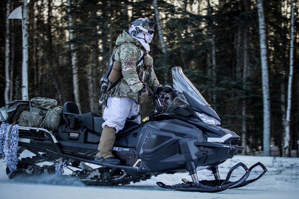 U.S. Army Soldiers assigned to the 11th Airborne Division patrol on snow machines during the Joint Pacific Multinational Readiness Center 24-02 exercise at Donnelly Training Area, Alaska, Feb. 17, 2024.