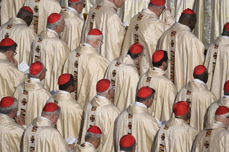 Prelates attend a mass presided over by Pope Francis and concelebrated by the new cardinals for the start of the XVI General Assembly of the Synod of Bishops in St. Peter's Square at The Vatican, Wednesday, Oct.4, 2023. Pope Francis is convening a global gathering of bishops and laypeople to discuss the future of the Catholic Church, including some hot-button issues that have previously been considered off the table for discussion. Key agenda items include women's role in the church, welcoming LGBTQ+ Catholics, and how bishops exercise authority. For the first time, women and laypeople can vote on specific proposals alongside bishops (AP Photo/Andrew Medichini)