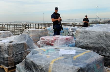 FILE PHOTO - Armed U.S. Coast Guardsmen aboard the Coast Guard Cutter Waesche stand watch as more than 39,000 pounds of seized cocaine is offloaded at Naval Base San Diego, California, U.S., October 27, 2016. REUTERS/Mike Blake