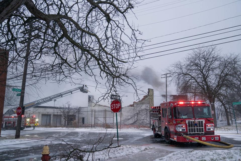 The Detroit firefighters fight a warehouse blaze through windy and freezing conditions on Detroit's east side Friday, Dec. 23, 2022.