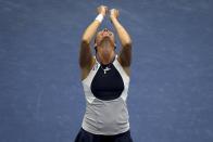 Flavia Pennetta of Italy throws her hands up in the air after defeating compatriot Roberta Vinci to win the women's singles final match at the U.S. Open tennis tournament in New York, September 12, 2015. REUTERS/Carlo Allegri TPX IMAGES OF THE DAY