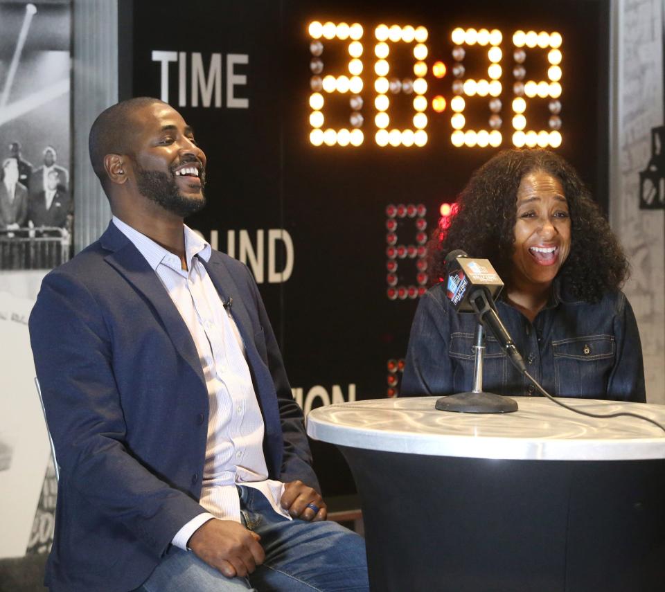 Marcus Mills and Melanie Mills, the son and wife of the late Sam Mills Jr., share a laugh while speaking to the media at the Pro Football Hall of Fame in Canton on Monday, March 14, 2022. Sam Mills Jr. is a member of the Class of 2022.