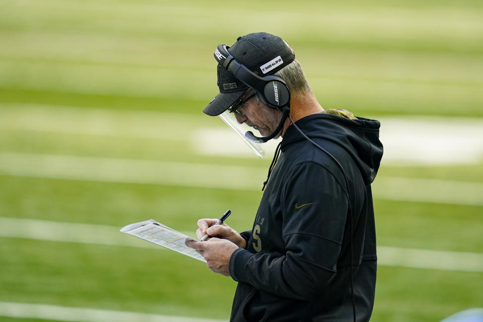 Indianapolis Colts head coach Frank Reich takes notes on the sideline in the first half of an NFL football game against the Baltimore Ravens in Indianapolis, Sunday, Nov. 8, 2020. (AP Photo/Darron Cummings)