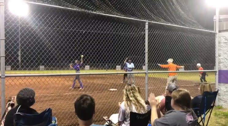 Despite reaching first base a full second before the ball, the umpire says Lindsey Harris was thrown out. (Twitter.com/@kaylajayyyy4)