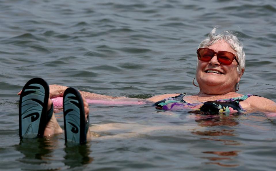 Lillian Mariscalo of Oyster Bay, N.Y. cools off in the waters of an Oyster Bay beach on Long Island's North shore Saturday, July 7, 2012. The heat gripping much of the country was set to peak Saturday in several places, with temperatures of more than 100 degrees expected in Philadelphia, excessive heat warnings in the Midwest and ongoing power outages of more than a week in the mid-Atlantic. (AP Photo/Craig Ruttle)