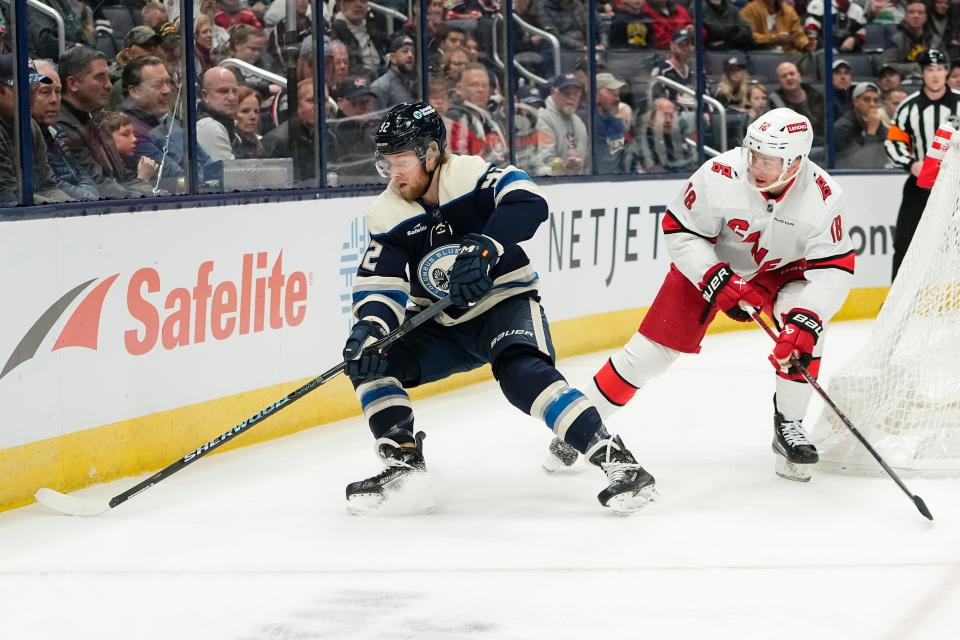 Feb 29, 2024; Columbus, Ohio, USA; Columbus Blue Jackets left wing Alexander Nylander (92) skates around Carolina Hurricanes center Jack Drury (18) during the first period of the NHL hockey game at Nationwide Arena.