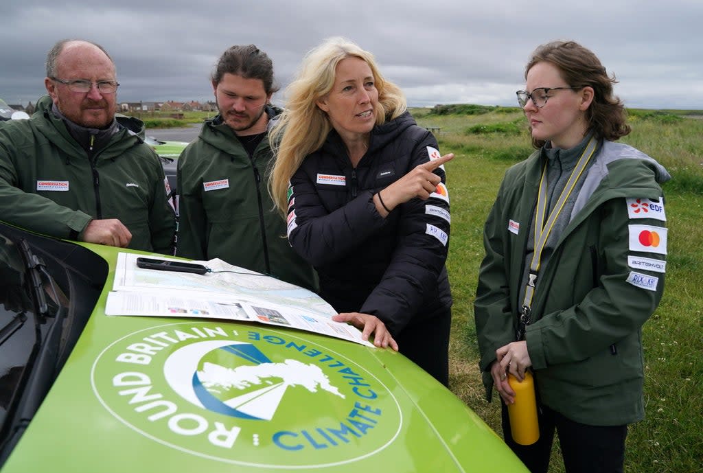 Paramotorist Sacha Dench (second right) with her team, including Dan Burton (left) (Andrew Milligan/PA) (PA Wire)