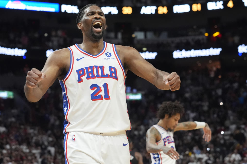 Philadelphia 76ers center Joel Embiid (21) celebrates as the team pulls ahead of the Miami Heat during the last minute of the second half of an NBA basketball game, Thursday, April 4, 2024, in Miami. The 76ers defeated the Heat 109-105. (AP Photo/Marta Lavandier)