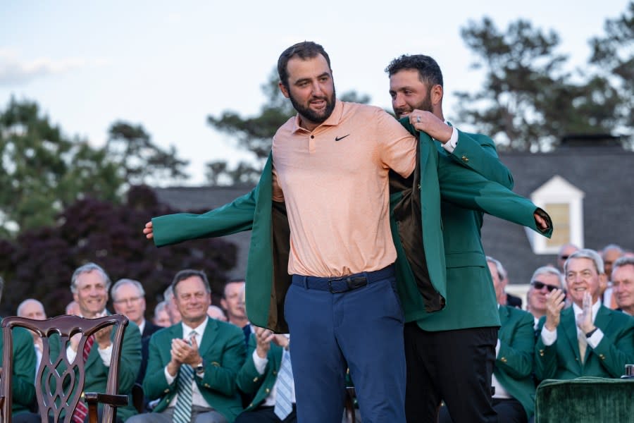 Masters champion Scottie Scheffler of the United States is presented the Green Jacket by Masters champion Jon Rahm of <a class="link " href="https://sports.yahoo.com/soccer/teams/spain-women/" data-i13n="sec:content-canvas;subsec:anchor_text;elm:context_link" data-ylk="slk:Spain;sec:content-canvas;subsec:anchor_text;elm:context_link;itc:0">Spain</a> during the Green Jacket Ceremony after winning the 2024 Masters Tournament at Augusta National Golf Club, Sunday, April 14, 2024. (Photo courtesy: Augusta National Golf Club)