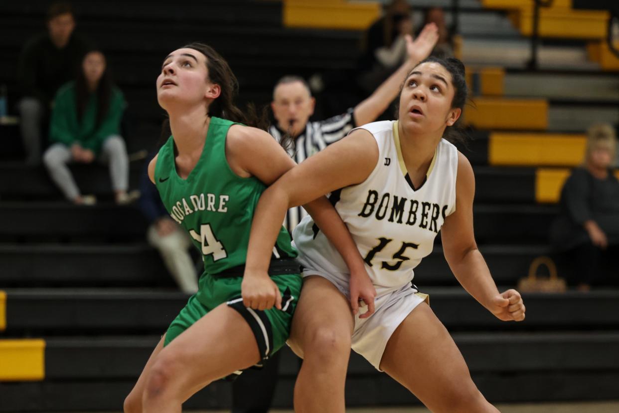 Mogadore junior Jocelyn Lawrentz and Windham sophomore Briah Daniel battle for a rebound during last week's game at Windham High School.