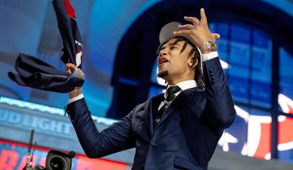 Ohio State quarterback CJ Stroud celebrates after being picked second overall by the Houston Texans during the NFL Draft outside of Union Station on Thursday, April 27, 2023, in Kansas City.