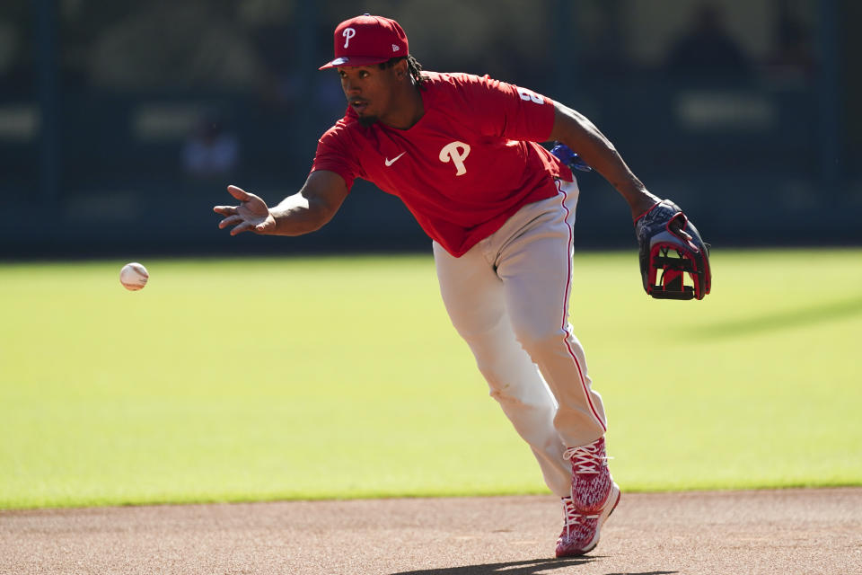 Philadelphia Phillies second baseman Jean Segura (2) works on his fielding skills during a practice session ahead of Game One of the National League Division baseball playoff game against the Atlanta Braves, Monday, Oct. 10, 2022, in Atlanta. (AP Photo/John Bazemore)