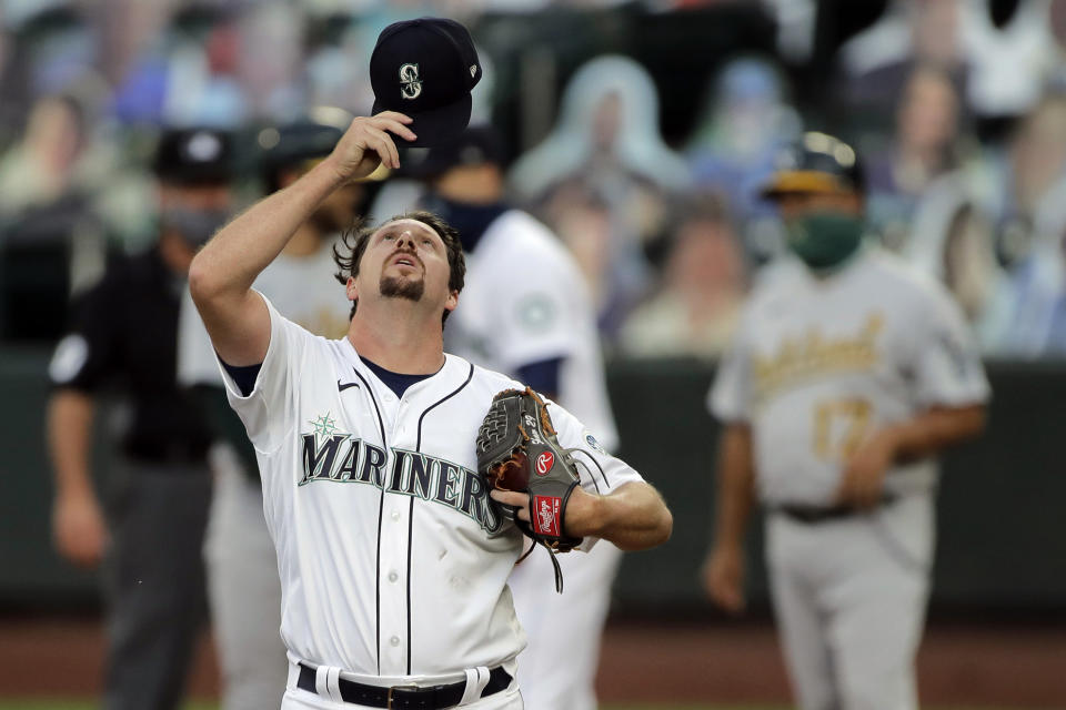 Seattle Mariners pitcher Bryan Shaw reacts on the mound during the fifth inning of a baseball game against the Oakland Athletics, Monday, Aug. 3, 2020, in Seattle. (AP Photo/Ted S. Warren)