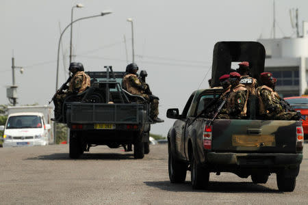 Soldiers of Ivory Coast presidential guard patrol as they arrive at the port of Abidjan, Ivory Coast, January 18, 2017. REUTERS/Luc Gnago