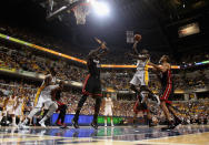 INDIANAPOLIS, IN - MAY 20: Darren Collison #2 of the Indiana Pacers goes up for a shot between Joel Anthony #50 and Shane Battier #31 of the Miami Heat in Game Four of the Eastern Conference Semifinals in the 2012 NBA Playoffs at Bankers Life Fieldhouse on May 20, 2012 in Indianapolis, Indiana. NOTE TO USER: User expressly acknowledges and agrees that, by downloading and/or using this photograph, User is consenting to the terms and conditions of the Getty Images License Agreement. (Photo by Jonathan Daniel/Getty Images)