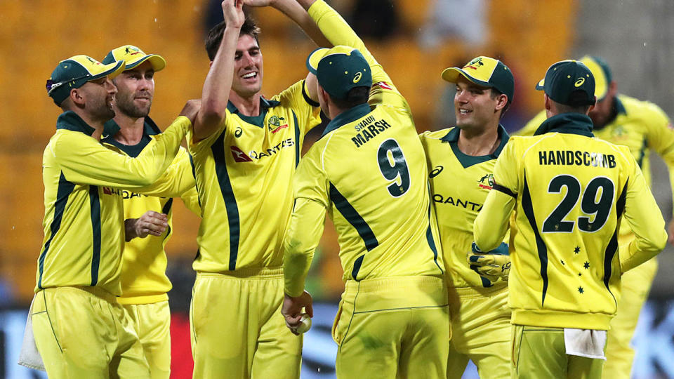 Pat Cummins celebrates with teammates. (Photo by MAHMOUD KHALED/AFP/Getty Images)