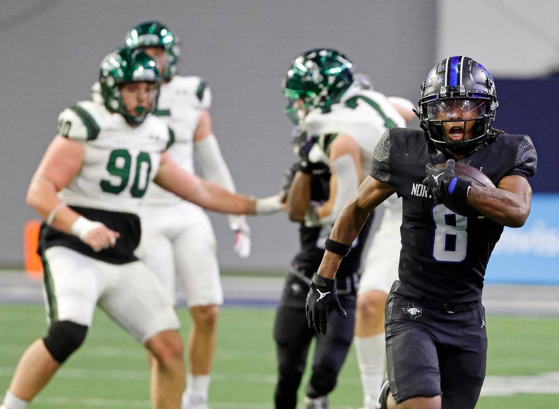 North Crowley running back Ashton Searl (8) brings the ball down field for a large gain in the first half of a UIL Class 6A Division 1 football regional-round playoff game at The Ford Center in Frisco, Texas, Saturday, Oct. 25, 2023.