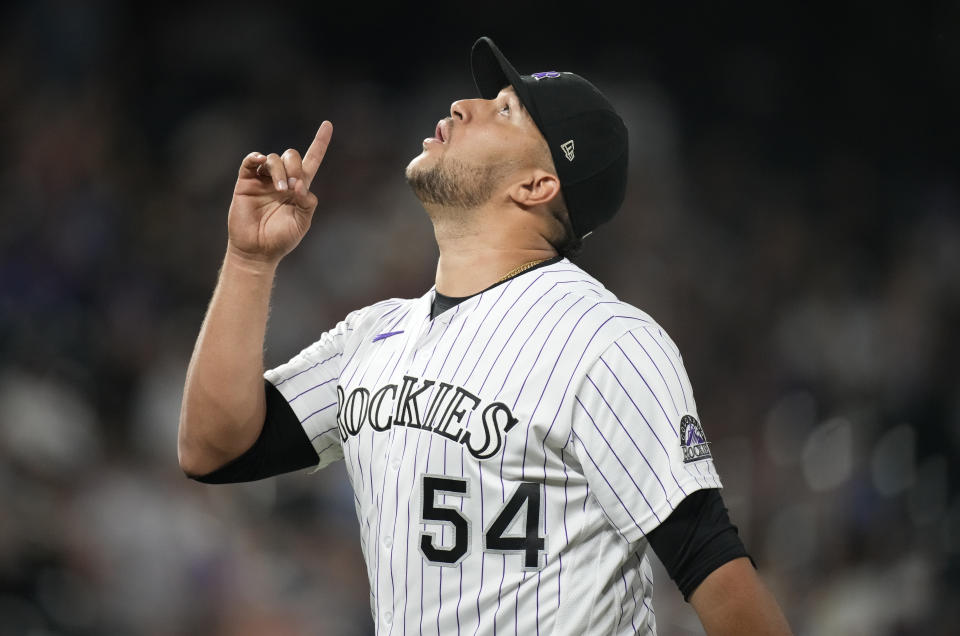 Colorado Rockies relief pitcher Carlos Estevez reacts after getting Milwaukee Brewers' Avisail Garcia to hit into a double play to end the top of the eighth inning of a baseball game Friday, June 18, 2021, in Denver. (AP Photo/David Zalubowski)