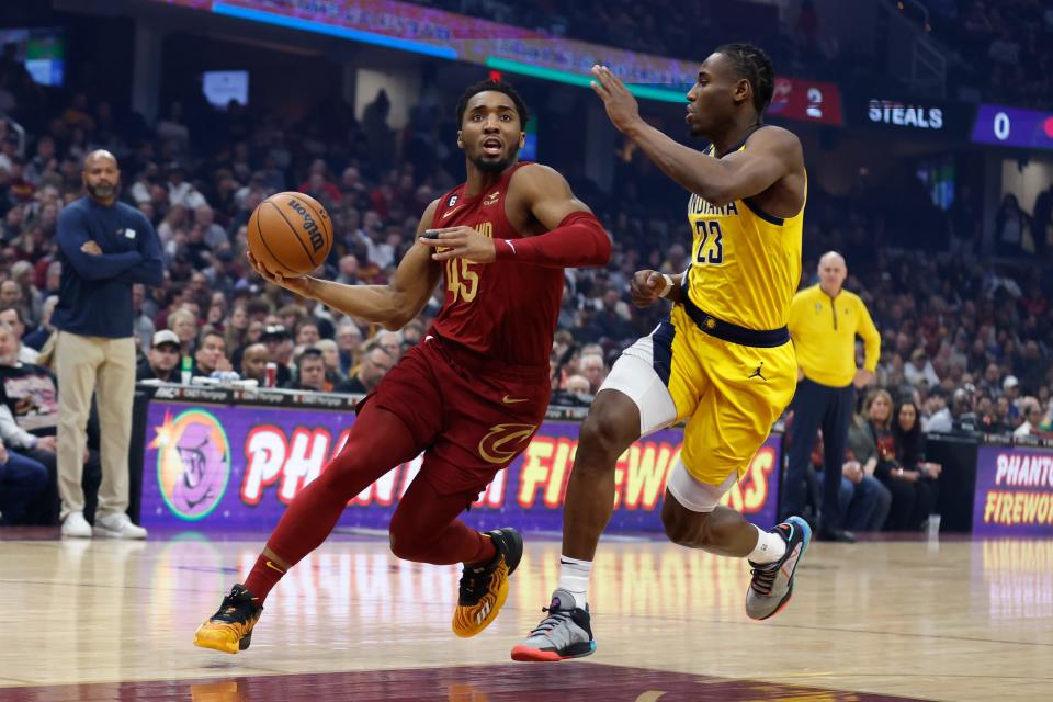 Cavaliers guard Donovan Mitchell drives against Pacers forward Aaron Nesmith during the first half on April 2.