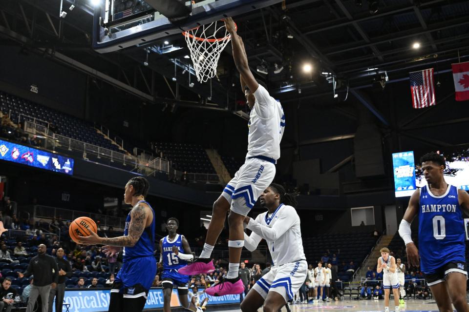 Delaware's Jalun Trent slams through an early dunk in Saturday's CAA Tournament win over Hampton at the Entertainment & Sports Arena in Washington, D.C.