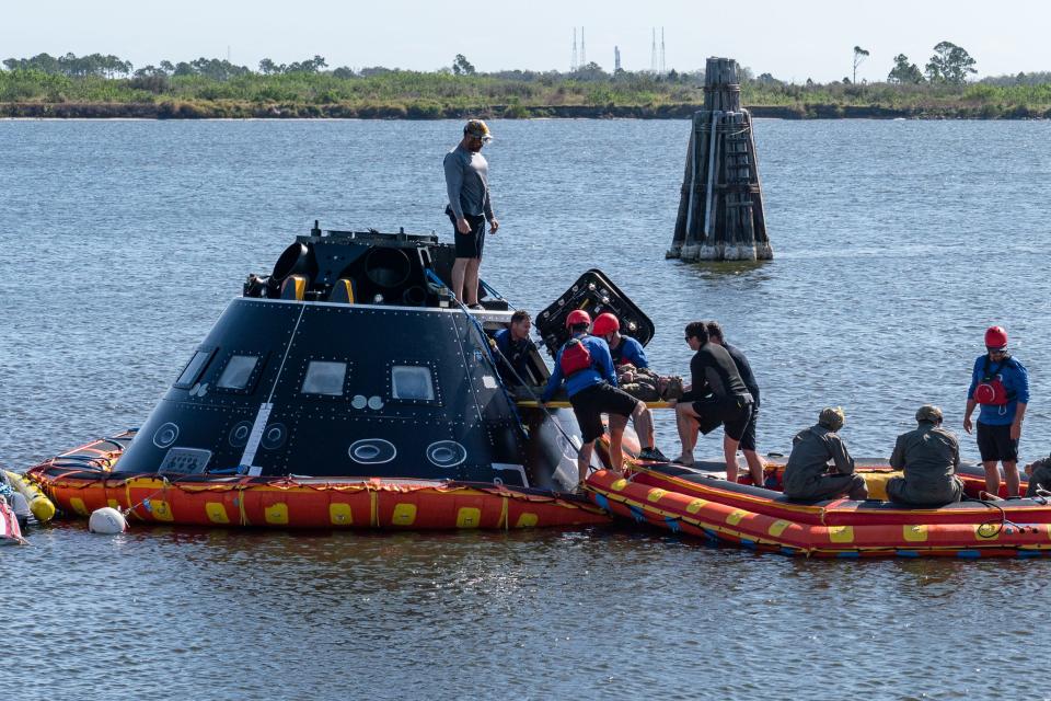 NASA and U.S. Navy teams practice Orion capsule recovery operations using a mockup capsule in February 2023 at Kennedy Space Center.