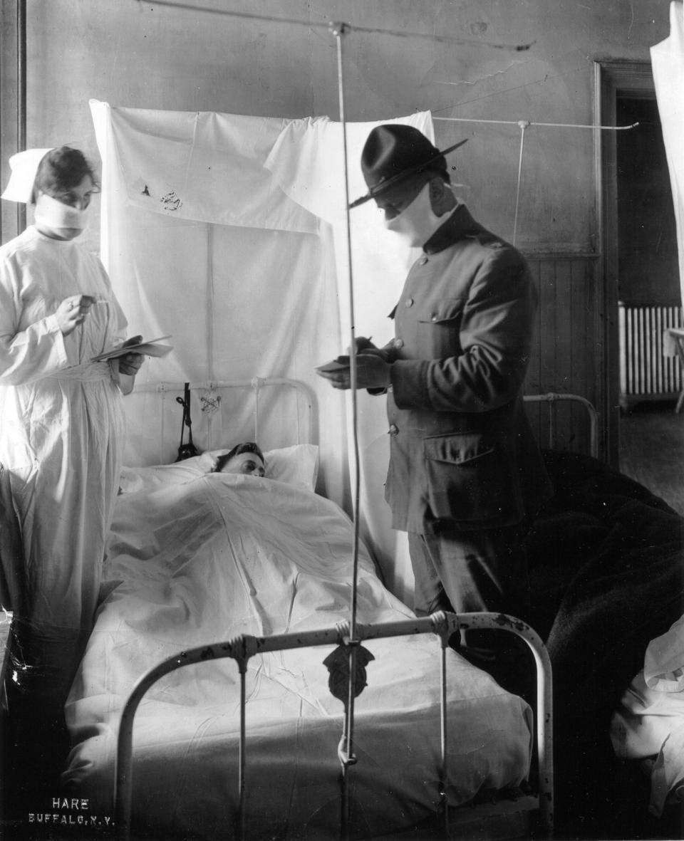 Spanish Influenza in Army Hospitals - Masks and cubicles used in USA General Hospital No 4, Fort Porter, New York, 1918. Patients' beds are reversed, alternately so breath of one patient will not be directed toward the face of another. (Photo by PhotoQuest/Getty Images)