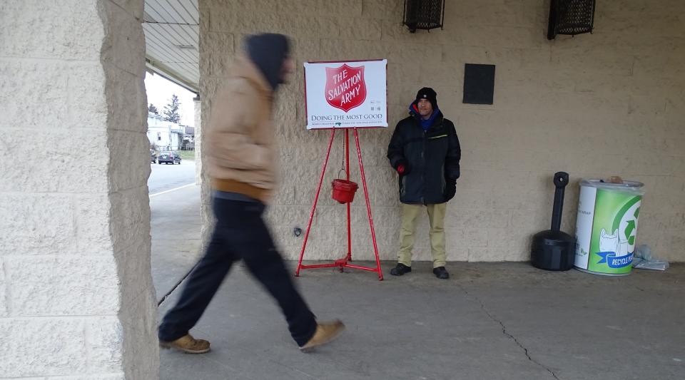 Bobby Hall rings the bell at a Salvation Army kettle outside the Bucyrus Kroger store in 2019.