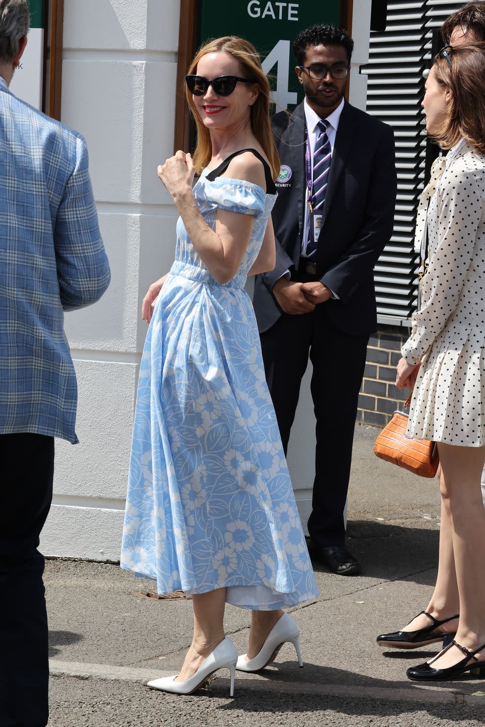 <p>Leslie Mann arrived for the opening day of the Wimbledon tennis tournament in a blue floral dress and white court shoes. </p>