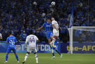 Saudi Arabia's Al Hilal' Sergej, and UAE's Al Ain' Matis Palacios, right, jump for the ball during the second leg of their AFC Champions League 2023/24 semi-final at Kingdom Arena Stadium in Riyadh, Saudi Arabia, Tuesday, April 23, 2024. (AP Photo)