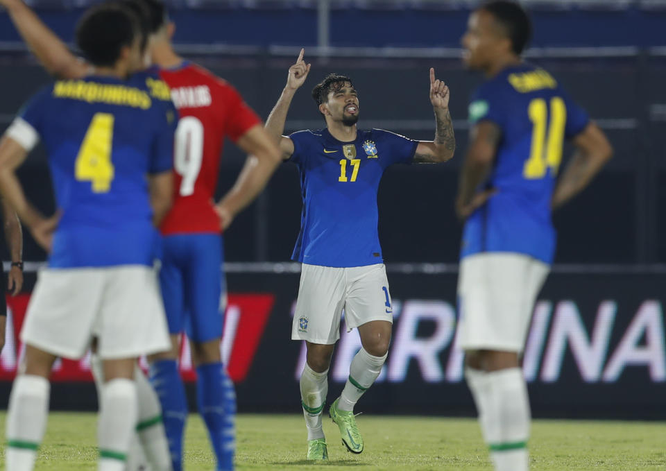 Brazil's Lucas Paqueta, center, celebrates after scoring his side's 2nd goal against Paraguay during a qualifying soccer match for the FIFA World Cup Qatar 2022 at Defensores del Chaco stadium in Asuncion, Paraguay, Tuesday, June 8, 2021. (AP Photo/Jorge Saenz)