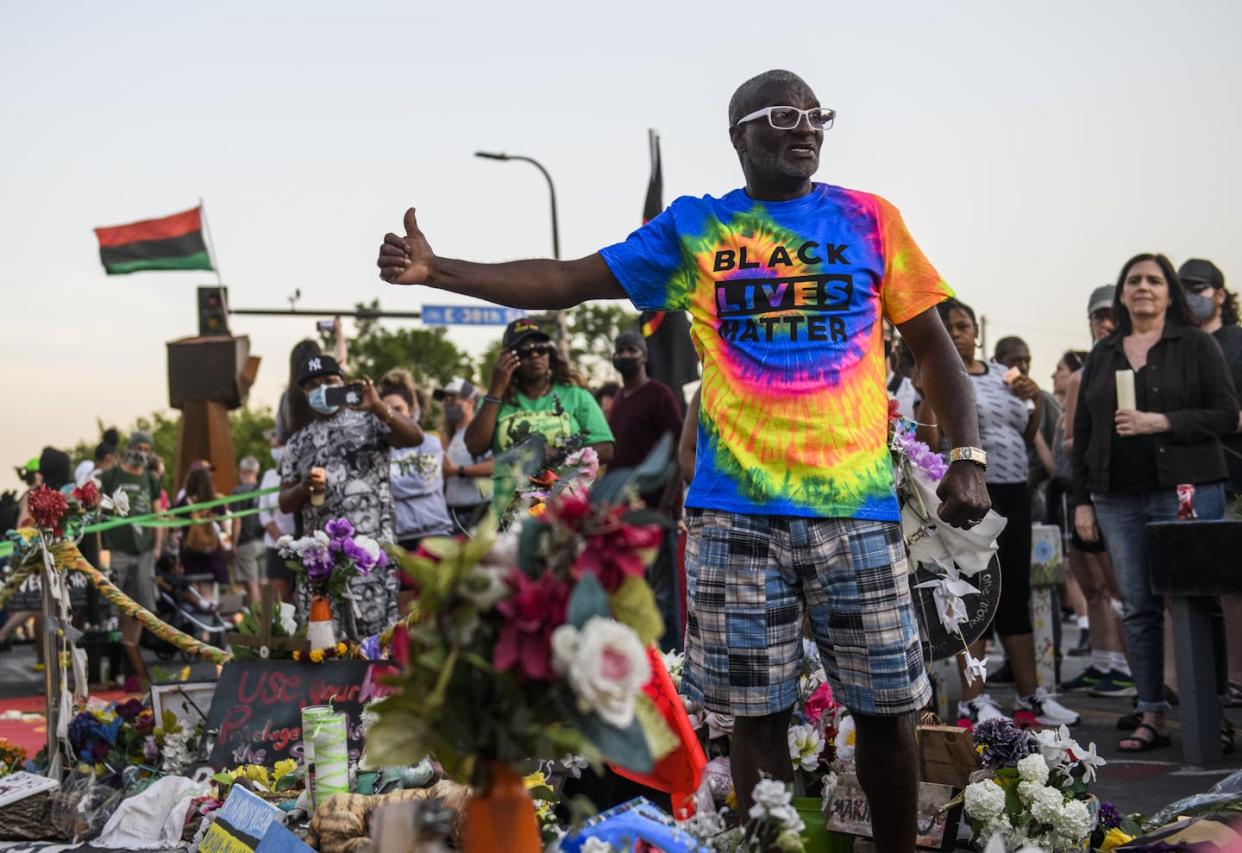 Charles McMillan, a witness to George Floyd's murder, speaks at the site where Floyd was killed on May 25, 2020, in Minneapolis. <a href="https://www.gettyimages.com/detail/news-photo/charles-mcmillan-a-witness-who-testified-in-the-derek-news-photo/1233109235?searchscope=image%2Cfilm&adppopup=true" rel="nofollow noopener" target="_blank" data-ylk="slk:Stephen Maturen/Getty Images;elm:context_link;itc:0;sec:content-canvas" class="link ">Stephen Maturen/Getty Images</a>