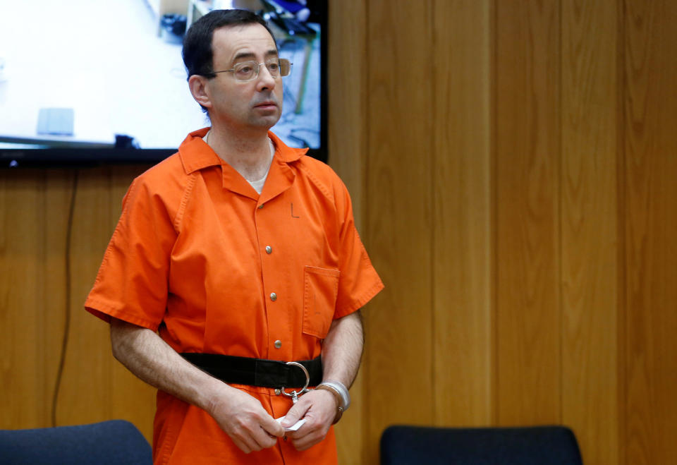 Larry Nassar, a former team USA Gymnastics doctor who pleaded guilty in November 2017 to sexual assault charges, stands in court during his sentencing hearing in the Eaton County Court in Charlotte, Michigan, U.S., February 5, 2018.  REUTERS/Rebecca Cook     TPX IMAGES OF THE DAY