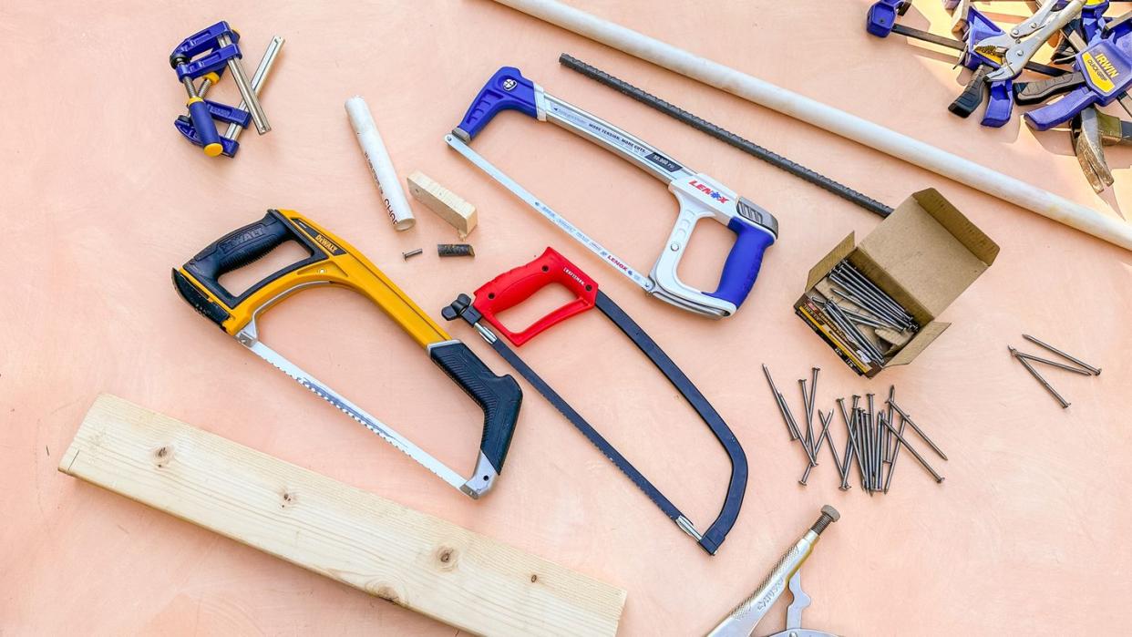 hacksaws and other building materials laid out on a table