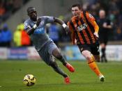 Newcastle United's Moussa Sissoko (L) is challenged by Hull City's Andrew Robertson during their English Premier League soccer match at the KC Stadium in Hull, northern England January 31, 2015. REUTERS/Andrew Yates