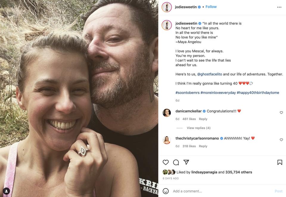 Jodie Sweetin and her fiancé pose after getting engaged in January 2022.