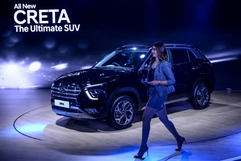 A model walks past the Hyundai Creta SUV in New Delhi in 2020. (Sajjad HUSSAIN)