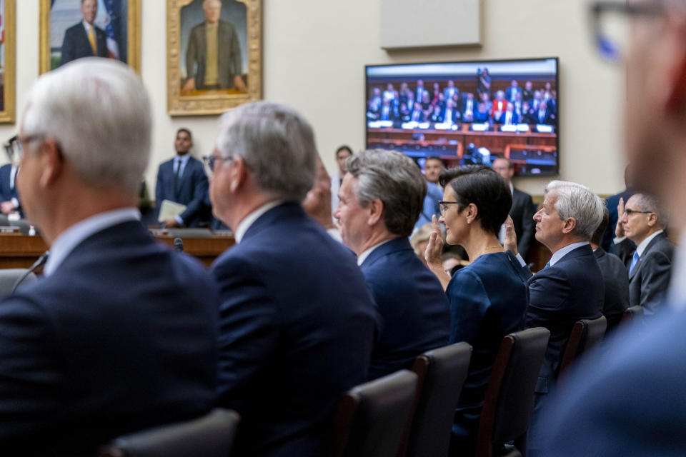 From left; Wells Fargo President and CEO Charles Scharf; Truist Financial Corporation Chairman and CEO William Rogers Jr.; Bank of America Chairman and CEO Brian Moynihan; Citigroup CEO Jane Fraser; JPMorgan Chase & Co. Chairman and CEO Jamie Dimon; PNC Financial Services Group Chairman, President, and CEO William Demchak; and U.S. Bancorp Chairman, President, and CEO Andy Cecere, are sworn in as they appear before a House Committee on Financial Services Committee hearing on "Holding Megabanks Accountable: Oversight of America's Largest Consumer Facing Banks" on Capitol Hill in Washington, Wednesday, Sept. 21, 2022. (AP Photo/Andrew Harnik)