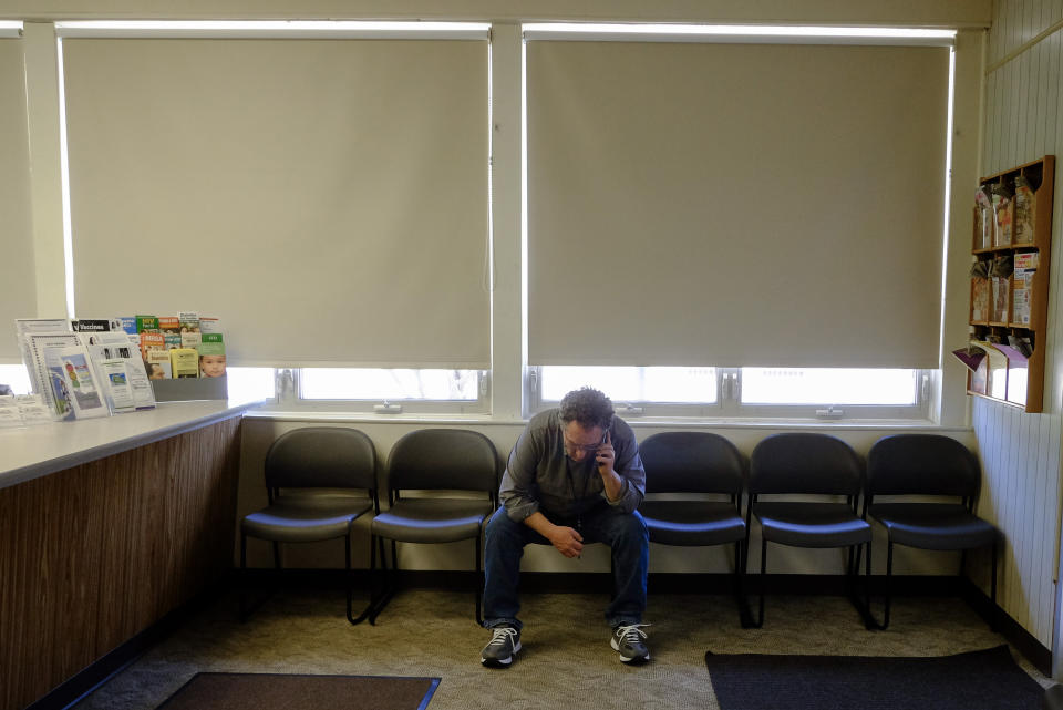 Decatur County's public health preparedness coordinator Sean Durbin listens to a conference call about the coronavirus, Thursday, April 2, 2020, in Greensburg, Ind. Decatur County is among three neighboring southeastern Indiana counties that all have confirmed COVID-19 cases among the highest per-capita rates in the country. (AP Photo/Darron Cummings)