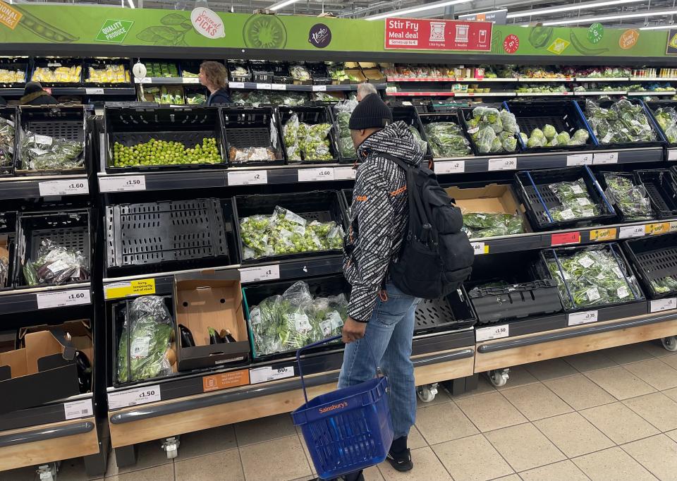 A customer shops for vegetables in the fruit and vegetable section of a Sainsbury's supermarket in east London on February 20, 2023. - British retail sales rebounded surprisingly in January on falling fuel costs and discounting by online and physical stores, official data showed Friday. At the same time, food sales dropped 0.5 percent, the ONS said, following large price rises over the past year. (Photo by Daniel LEAL / AFP) (Photo by DANIEL LEAL/AFP via Getty Images)