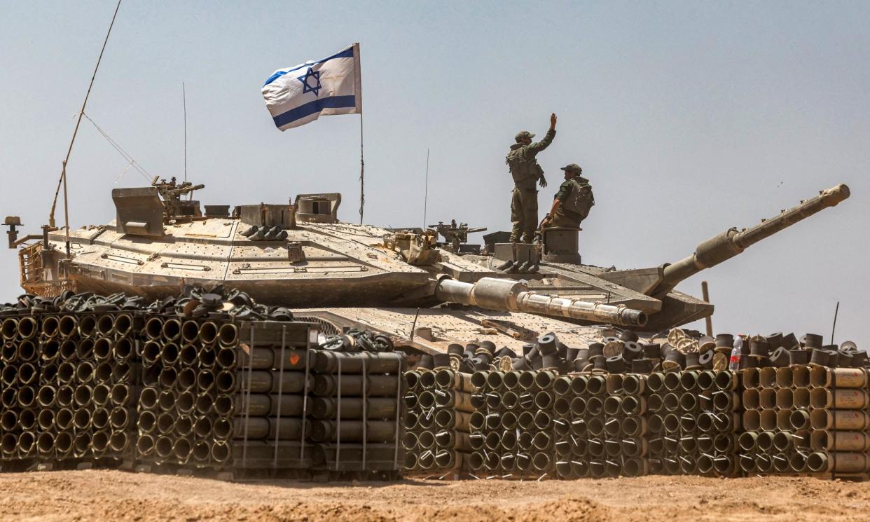 <span>An Israeli army soldier in southern Israel near the Gaza Strip on 9 May 2024.</span><span>Photograph: Ahmad Gharabli/AFP/Getty Images</span>