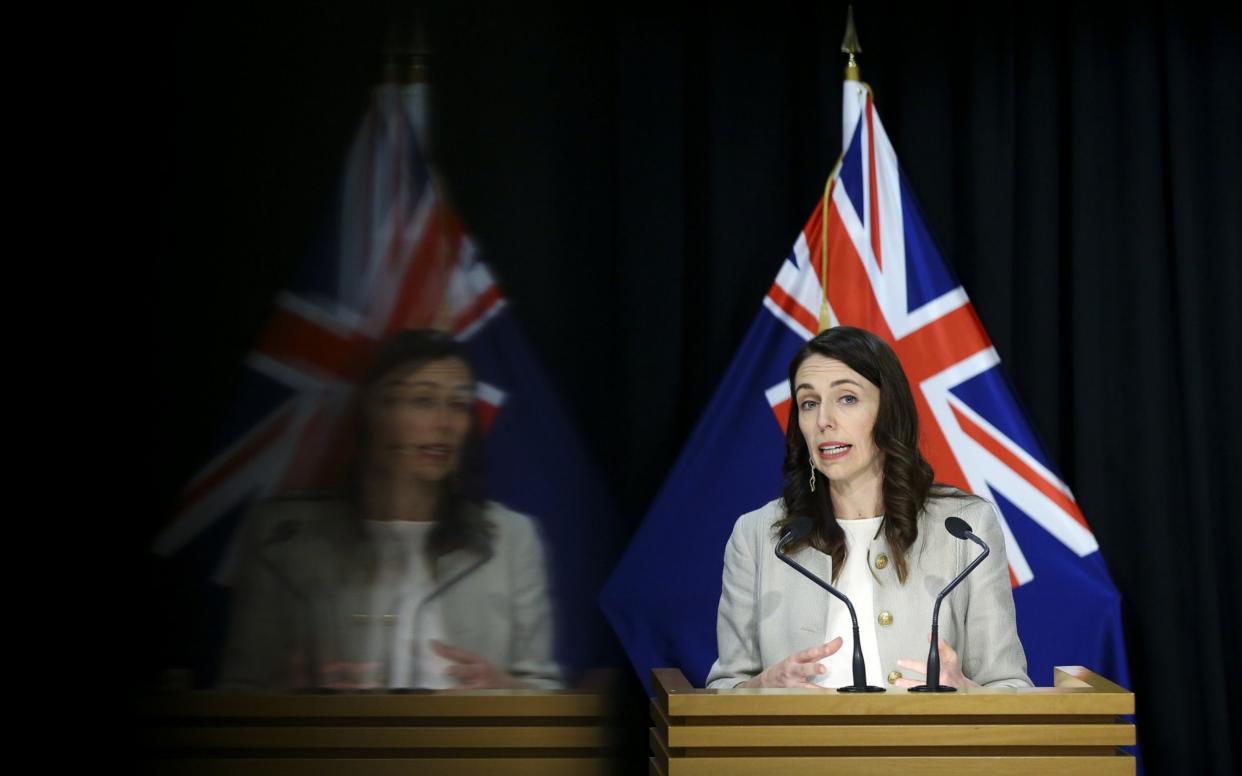 New Zealand Premier Jacinda Ardern tells the country at a press conference that containment measures against a new outbreak of coronavirus in Auckland will stay in place for another 12 days   - Hagen Hopkins/Getty Images 