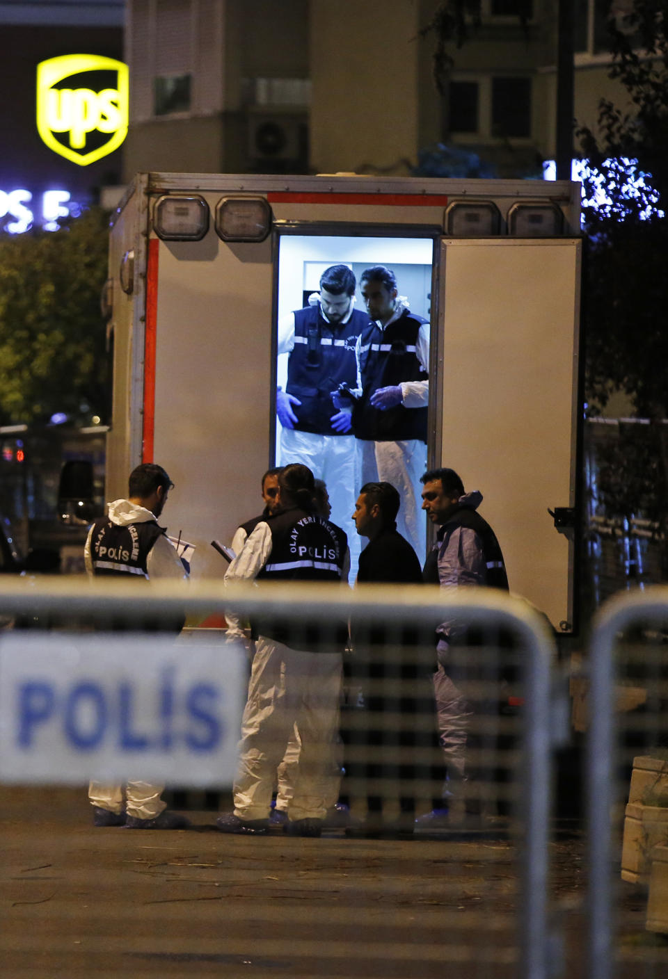 Turkish police officers prepare to enter the Saudi Arabia's Consulate in Istanbul, Monday, Oct. 15, 2018. Turkish crime scene investigators dressed in coveralls and gloves entered the consulate Monday, nearly two weeks after the disappearance and alleged slaying of Saudi writer Jamal Khashoggi there. (AP Photo/Emrah Gurel)