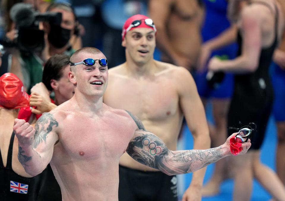 Great Britain’s Adam Peaty and James Guy celebrate winning the Mixed 4×100 metres medley relay at Tokyo Aquatics Centre (Joe Giddens/PA) (PA Wire)