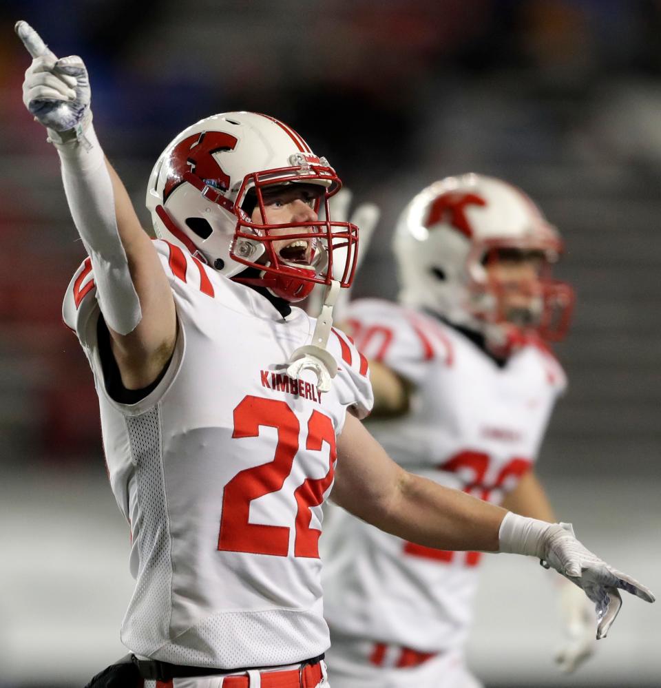 Kimberly's Thomas Meyers (22) reacts to a fumble recovery against Mukwonago during the WIAA Division 1 state championship game Friday at Camp Randall Stadium in Madison.