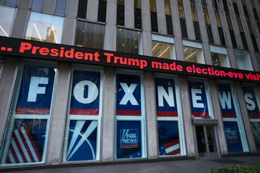 FILE - A headline about President Donald Trump is displayed outside Fox News studios in New York on Nov. 28, 2018. A voting technology company suing Fox News is arguing that Fox Corp. leaders Rupert and Lachlan Murdoch played a leading role in deciding to air false claims that the technology helped "steal" the 2020 presidential election from former President Donald Trump, according to a filing Monday, March 6, 2023. (AP Photo/Mark Lennihan, File)