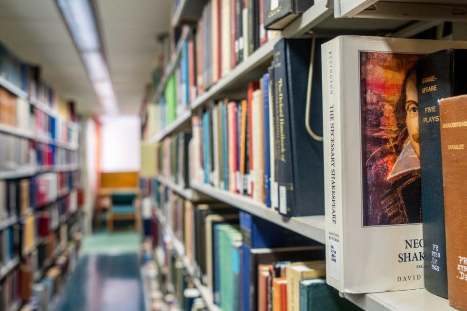 Books line the shelves at the Rice University Library on April 26, 2022 in Houston, Texas.