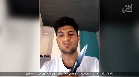 A still image from an undated video Islamic State posted July 19, 2016 in which a man whom it identifies as the Afghan refugee who attacked passengers with an axe on a train in Germany vows to carry out a suicide mission and urges other Muslims to do the same. Social Media via REUTERS TV